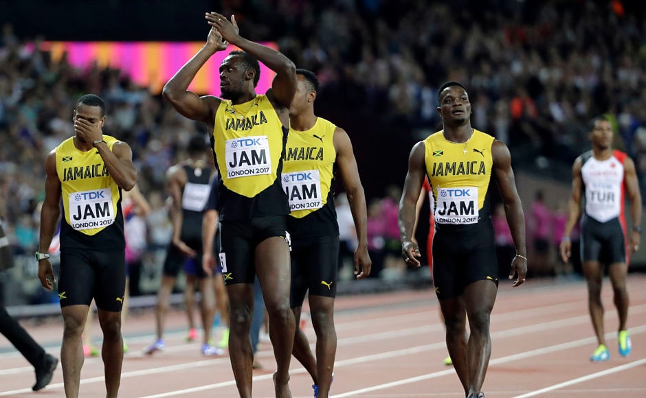 Jamaica's Usain Bolt, second left, walks with his teammates acknowledging the crowd that rallied behind him despite his having to pull out of the race with just 50 metres to spare in the last lap due to a hamstring injury. AP Jamaica's Usain Bolt, second left, walks with his teammates acknowledging the crowd that rallied behind him despite his having to pull out of the race with just 50 metres to spare in the last lap due to a hamstring injury. AP