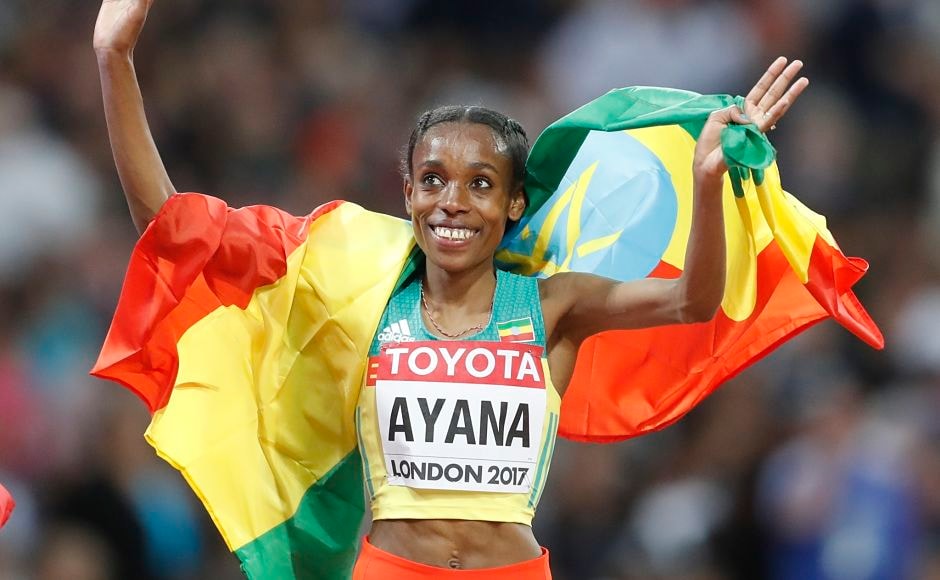 Ethiopia's Almaz Ayana celebrates during a victory lap after winning the Women's 10,000m final. AP