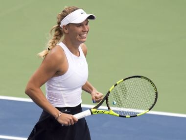 Caroline Wozniacki, of Denmark, smiles after defeating Karolina Pliskova, of the Czech Republic, in the quarterfinals of the Rogers Cup tennis tournament in Toronto on Friday, Aug. 11, 2017. (Frank Gunn/The Canadian Press via AP)