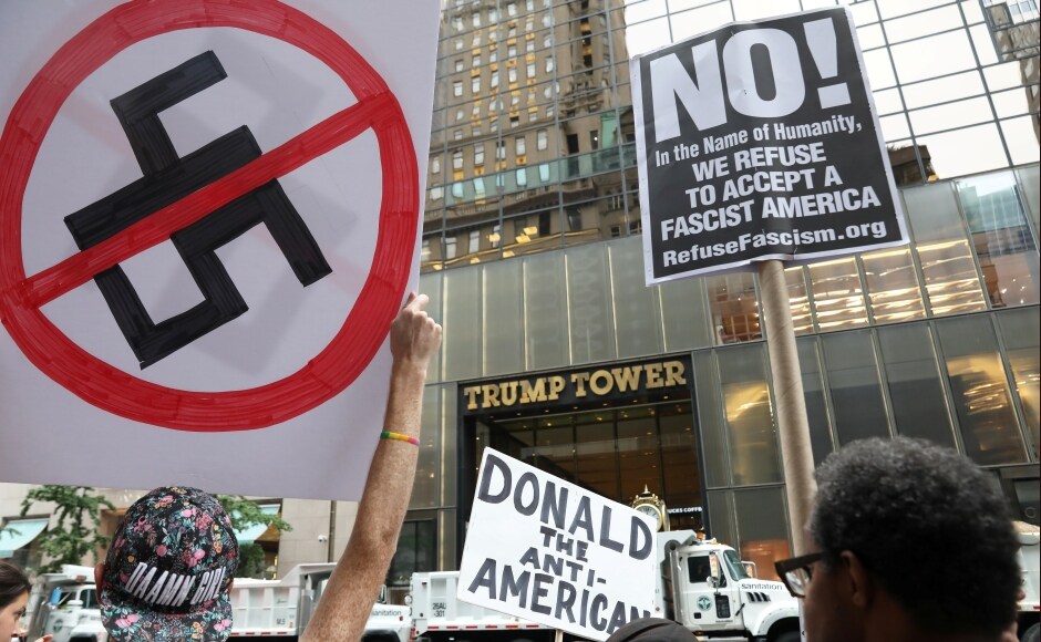 People also resorted to more traditional ways of protest as they waved anti-Trump signs in front of Trump Tower in New York City. Trump was widely criticised for failing to quickly and unequivocally denounce the actions of white supremacists in Charlottesville. Reuters People also resorted to more traditional ways of protest as they waved anti-Trump signs in front of Trump Tower in New York City. Trump was widely criticised for failing to quickly and unequivocally denounce the actions of white supremacists in Charlottesville. Reuters
