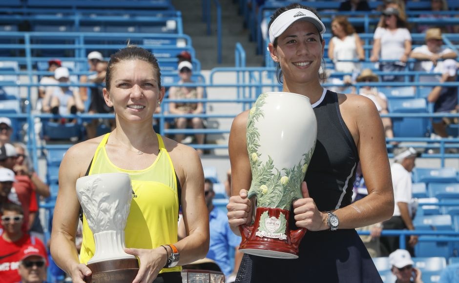 Garbine Muguruza (R) won her first title in the US and her second of the year, along with Wimbledon. For Simona Halep (L) though, it was a big disappointment as it was the third time this season that she needed one more win to move up to World No 1 and couldn't get it. AP Garbine Muguruza (R) won her first title in the US and her second of the year, along with Wimbledon. For Simona Halep (L) though, it was a big disappointment as it was the third time this season that she needed one more win to move up to World No 1 and couldn't get it. AP