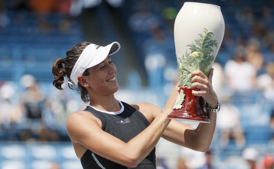 Garbine Muguruza defeated Simona Halep 6-1, 6-0 for her first Cincinnati Masters title on Sunday, needing only 56 minutes to extend her run of success. AP Garbine Muguruza defeated Simona Halep 6-1, 6-0 for her first Cincinnati Masters title on Sunday, needing only 56 minutes to extend her run of success. AP
