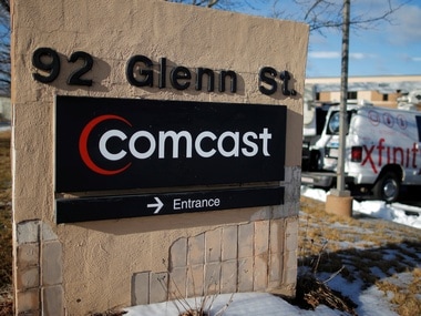 A sign marks a Comcast facility . Reuters