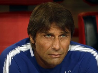 Chelsea's manager Antonio Conte watches the pregame ceremonies before the start of his team's friendly soccer match against Arsenal in Beijing, Saturday, July 22, 2017. Chelsea beat Arsenal, 3-0. (AP Photo/Mark Schiefelbein)