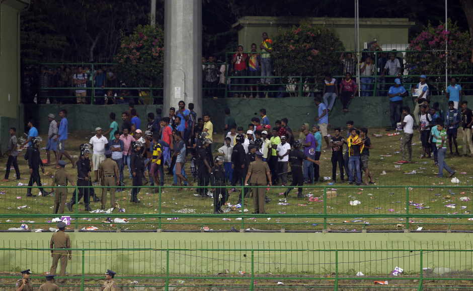 As India inched towards a series-clinching victory the crowd at Palekelle threw bottles at the players to stop the match. AP As India inched towards a series-clinching victory the crowd at Palekelle threw bottles at the players to stop the match. AP