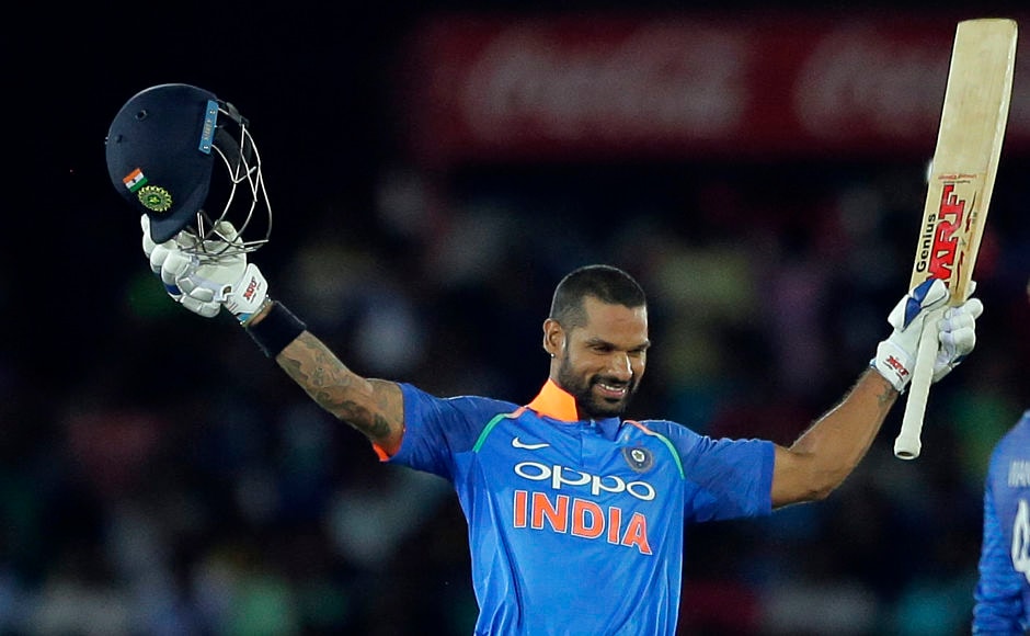 India's Shikhar Dhawan raises his bat and helmet to celebrate his 11th ODI century. AP India's Shikhar Dhawan raises his bat and helmet to celebrate his 11th ODI century. AP