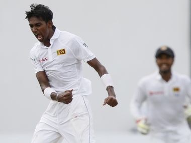 Sri Lanka's Dushmantha Chameera (front) celebrates with his teammates after taking the wicket of Pakistan's Asad Shafiq (not pictured) during the fourth day of their second test cricket match in Colombo June 28, 2015. REUTERS/Dinuka Liyanawatte - RTX1I45I