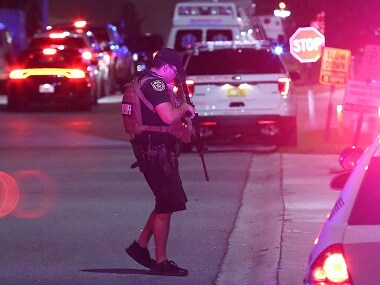 A law enforcement officer stands guard outside Osceola Regional Medical Center in Kissimmee. AP