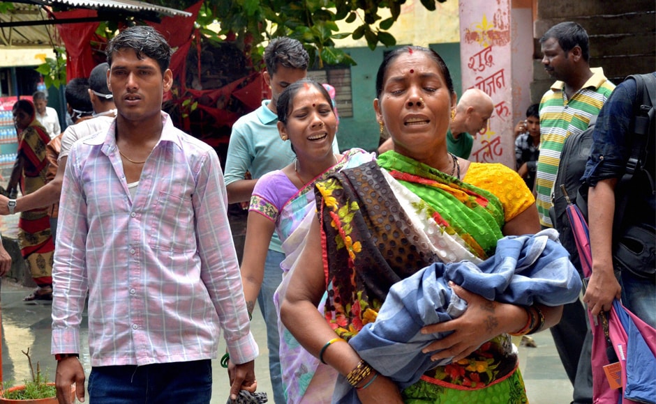 Relatives carry a child at the BRD Medical College. There has been complete panic since the news broke on Friday that several children died due to alleged non-supply of oxygen. Most parents have lost confidence in the hospital and they want to take their children home or to another hospital. PTI Relatives carry a child at the BRD Medical College. There has been complete panic since the news broke on Friday that several children died due to alleged non-supply of oxygen. Most parents have lost confidence in the hospital and they want to take their children home or to another hospital. PTI