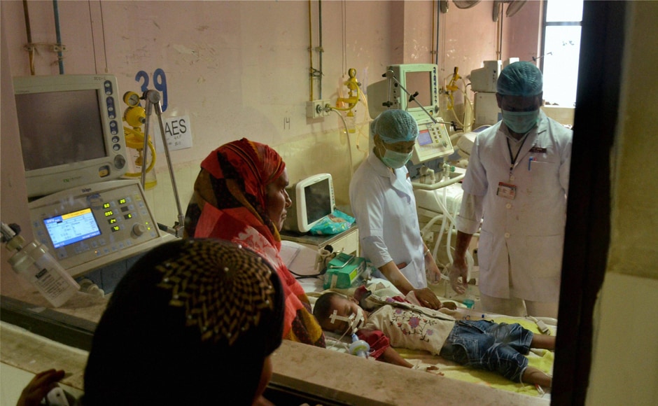 Distraught relatives look on as children receive treatment in the encephalitis ward at the Baba Raghav Das (BRD) Medical College and Hospital where over 72 children have died over the past one week, in Gorakhpur district on Monday. PTI Distraught relatives look on as children receive treatment in the encephalitis ward at the Baba Raghav Das (BRD) Medical College and Hospital where over 72 children have died over the past one week, in Gorakhpur district on Monday. PTI