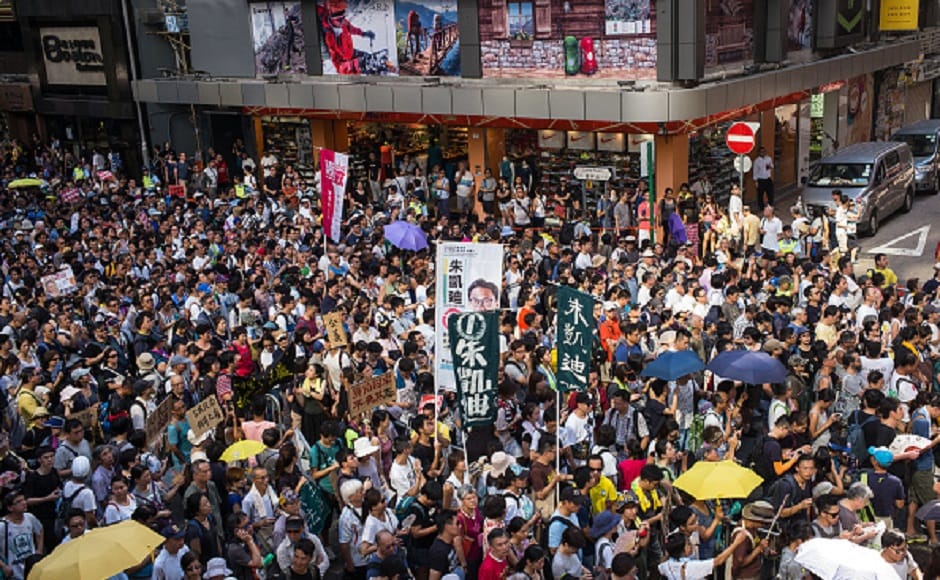 Demonstrators walked from Wan Chai district to the Court of Final Appeal, where the three activists are expected to lodge an appeal. Getty Images Demonstrators walked from Wan Chai district to the Court of Final Appeal, where the three activists are expected to lodge an appeal. Getty Images