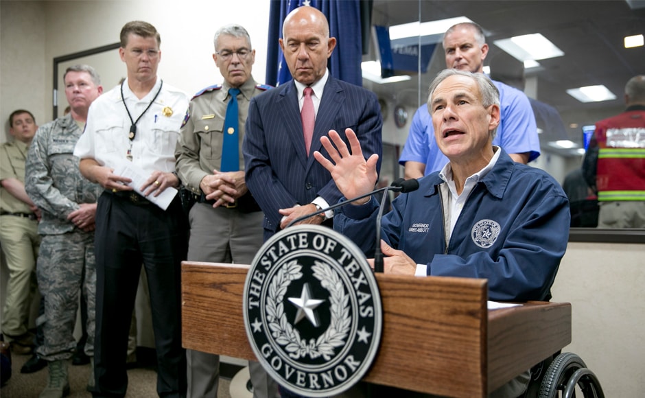 Texas governor Greg Abbott speaks at a news conference about Hurricane Harvey at the State Operations Center in Austin, Texas, on Friday. Abbot deployed more than 1,000 national guardsmen to help with evacuation and recovery. AP Texas governor Greg Abbott speaks at a news conference about Hurricane Harvey at the State Operations Center in Austin, Texas, on Friday. Abbot deployed more than 1,000 national guardsmen to help with evacuation and recovery. AP