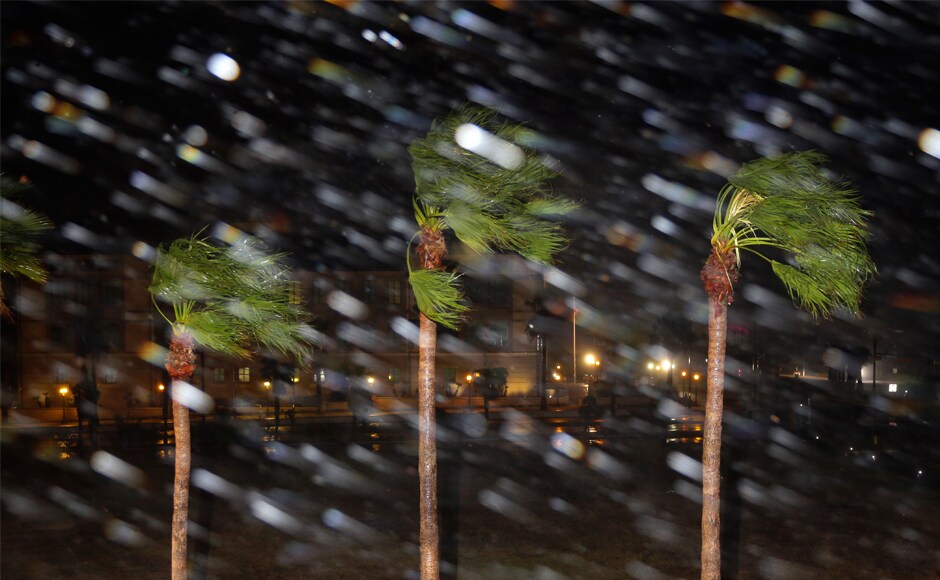 Rain blows past palm trees as Hurricane Harvey made landfall on Friday. The National Hurricane Centre (NHC) warned of likely Rain blows past palm trees as Hurricane Harvey made landfall on Friday. The National Hurricane Centre (NHC) warned of likely