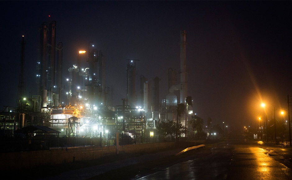 A Valero oil refinery's flare continues to burn as Hurricane Harvey made landfall in Corpus Christi on Friday. The powerful storm has forced thousands to flee their homes and crippled oil production in the Gulf. AP A Valero oil refinery's flare continues to burn as Hurricane Harvey made landfall in Corpus Christi on Friday. The powerful storm has forced thousands to flee their homes and crippled oil production in the Gulf. AP