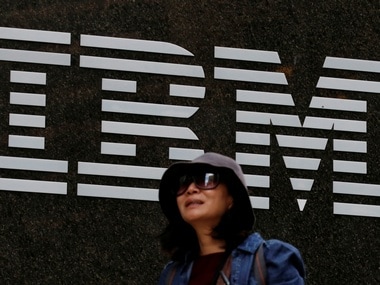 A woman passes by the IBM offices in New York. Image: Reuters