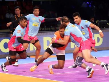 Jaipur Pink Panthers defenders bring down Puneri Paltans' raider in their win on Thursday. Image courtesy: Twitter/@prokabaddi