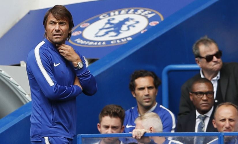Chelsea's manager Antonio Conte, left, watches the match during the English Premier League soccer match between Chelsea and Burnley at Stamford Bridge stadium in London, Saturday, Aug. 12, 2017. (AP Photo/Kirsty Wigglesworth)
