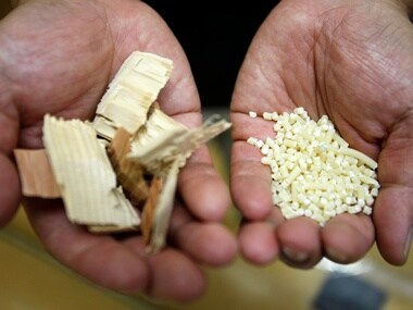 Kyoto University Professor Hiroyuki Yano, shows wood chips (L) and fibers before they are converted into cellulose nanofibers. Reuters.