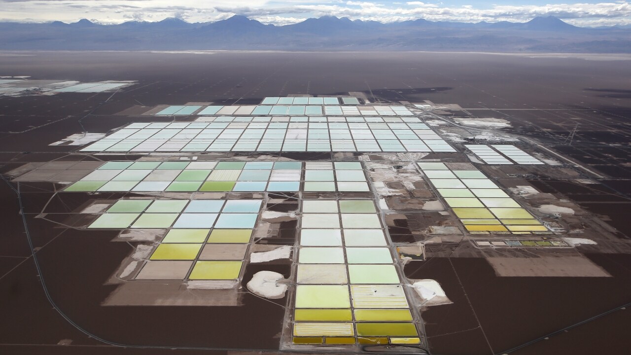 An aerial view shows the brine pools and processing areas of the Soquimich (SQM) lithium mine on the Atacama salt flat. Image Credit: Reuters
