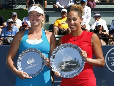Madison Keys holds the winner's plate next to Coco Vandeweghe with the runner-up plate. AP