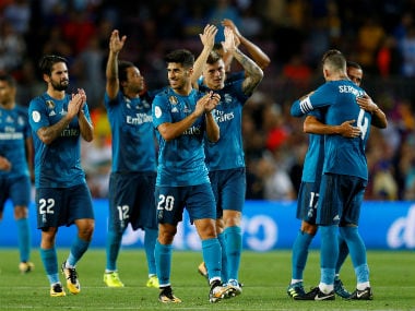 Real Madrid’s Marco Asensio celebrates with teammates after the match. Reuters
