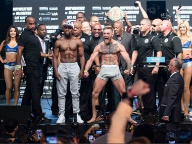 Floyd Mayweather and Conor McGregor pose after making weight. Image Courtesy: Twitter @ShowtimeBoxing