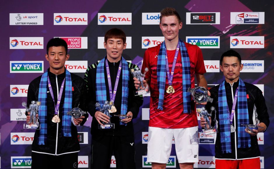 Denmark's Viktor Axelsen (2nd from right) held his nerve to win his first World Badminton Championships at the expense of his idol, the great Lin Dan (R) on Sunday. Reuters Denmark's Viktor Axelsen (2nd from right) held his nerve to win his first World Badminton Championships at the expense of his idol, the great Lin Dan (R) on Sunday. Reuters