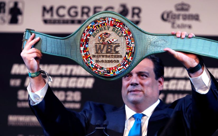 WBC President Mauricio Sulaiman holds up the "Money Belt" during a news conference with undefeated boxer Floyd Mayweather and UFC lightweight champion Conor McGregor in Las Vegas. Reuters