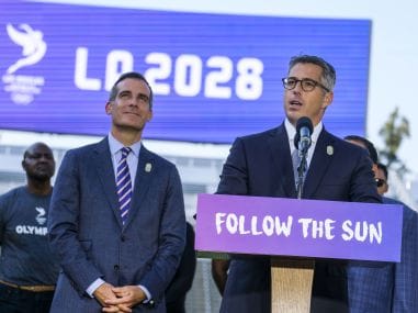 Mayor Eric Garcetti listens as LA Olympic Committee leader Casey Wasserman speaks during a press conference. AP