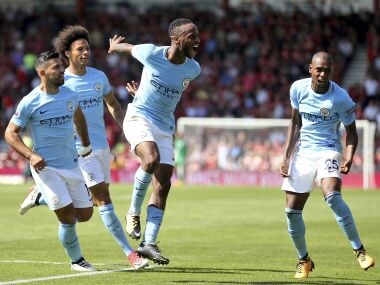 Manchester City's Raheem Sterling, center, celebrates scoring his side's second goal during the Premier League soccer match between AFC Bournemouth and Manchester City at the Vitality Stadium, Bournemouth, England. Saturday Aug. 26, 2017. (Steve Paston/PA via AP)