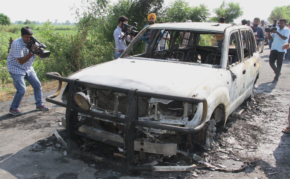 The burnt remains of a car torched by unknown people at Kotli village in Sirsa on Monday. Dera followers allegedly set two cars on fire near the DSS headquarters in Sirsa, before the sentence was pronounced. PTI The burnt remains of a car torched by unknown people at Kotli village in Sirsa on Monday. Dera followers allegedly set two cars on fire near the DSS headquarters in Sirsa, before the sentence was pronounced. PTI