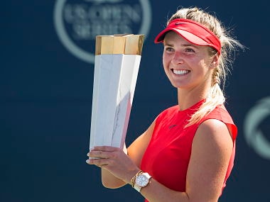 Elina Svitolina of Ukraine poses for photographs with the trophy after defeating Caroline Wozniacki of Denmark during women's final Rogers Cup the trophy tennis action in Toronto on Sunday, Aug. 13, 2017. (Nathan Denette/The Canadian Press via AP)