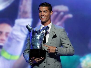 Real Madrid's Cristiano Ronaldo with the UEFA Men's Player of the Season award. Reuters