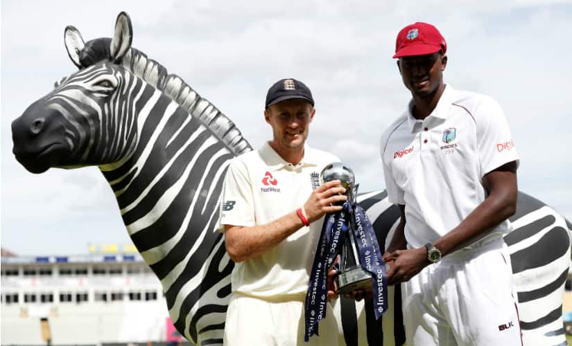 England captain Joe Root and West Indies’ Jason Holder pose with the Test series trophy ahead of the day-night Test in Edgbaston. Reuters