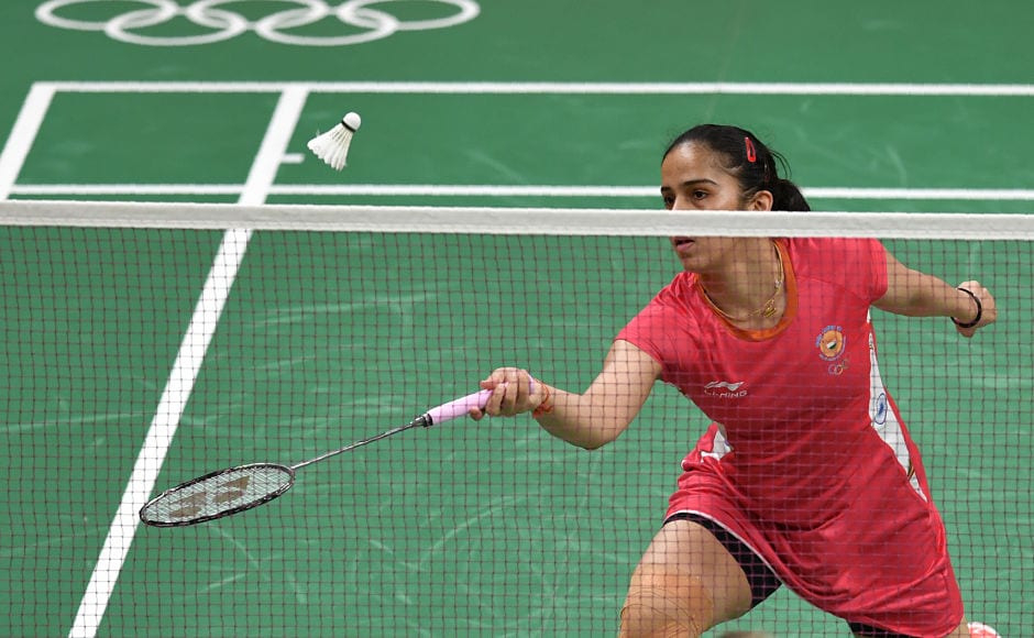 India's Saina Nehwal returns to Ukraine's Maria Ulitina during their women's singles match. Sain won the game in just 33 minutes. AFP