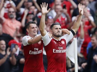 Arsenal's Sead Kolasinac, right, celebrates scoring his sides first goal during the English Community Shield soccer match between Arsenal and Chelsea at Wembley Stadium in London, Sunday, Aug. 6, 2017. (AP Photo/Kirsty Wigglesworth)