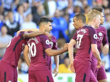 Manchester City's Sergio Aguero, centre, celebrates scoring his side's first goal. AP