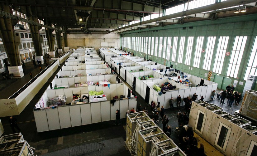 A general view of a shelter for migrants inside a hangar of the former Tempelhof airport in Berlin, Germany, December 9, 2015. REUTERS/Fabrizio Bensch