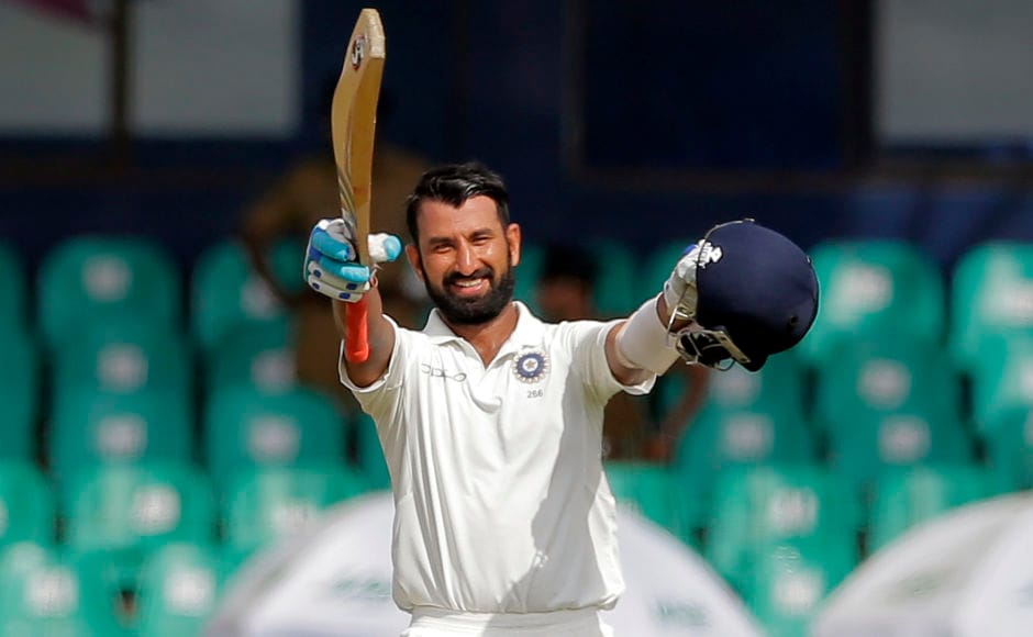 India's Cheteshwar Pujara raised his bat and helmet to celebrate his 13 Test century. It was also his 2nd century of the series and 3rd against the hosts Sri Lanka. Pujara remained unbeaten on 128. AP India's Cheteshwar Pujara raised his bat and helmet to celebrate his 13 Test century. It was also his 2nd century of the series and 3rd against the hosts Sri Lanka. Pujara remained unbeaten on 128. AP