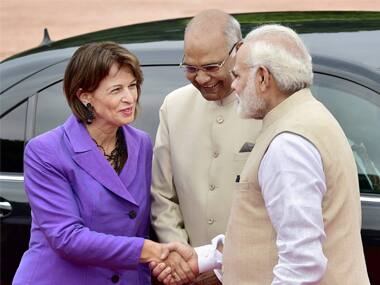 Narendra Modi shakes Swiss president Doris Leuthard’s hand while President Ram NAth Kovind looks on. PTI