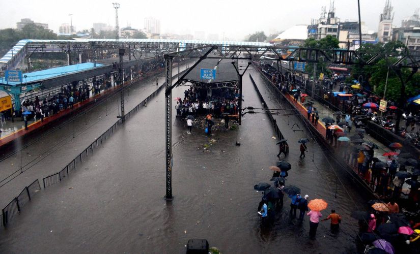 Mumbaikars stranded at the Thane station on Tuesday. PTI
