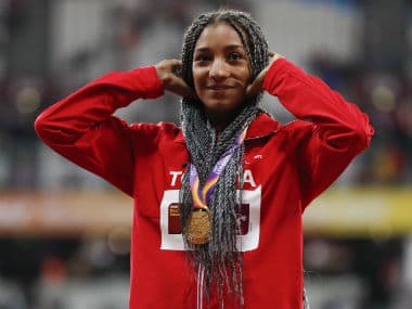 Nafissatou Thiam poses with her gold medal at the presentation ceremony in London on Sunday. Reuters