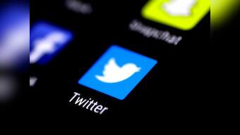 Artist stencils hate speech tweets in front of Twitter headquarter in Hamburg