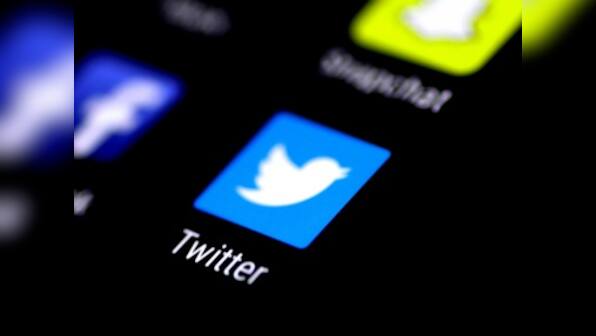 Artist stencils hate speech tweets in front of Twitter headquarter in Hamburg