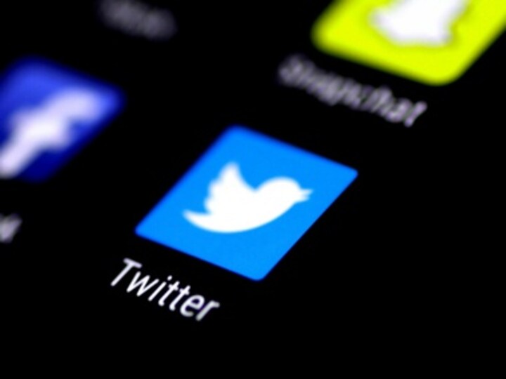 Artist stencils hate speech tweets in front of Twitter headquarter in Hamburg