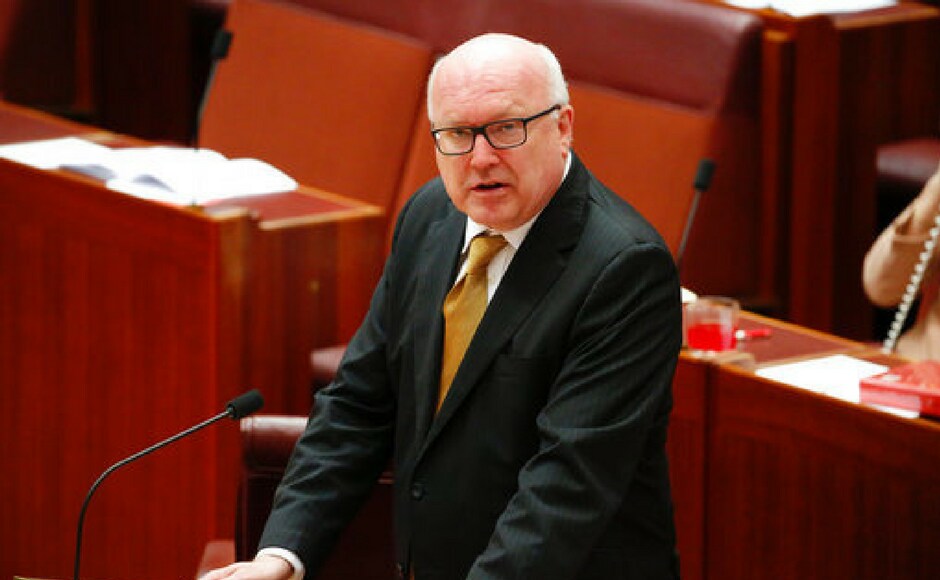 Attorney-General George Brandis stands to chastise Hanson who provoked an angry backlash from lawmakers by wearing a burqa in Parliament House in Canberra, Australia on Thursday. AP Attorney-General George Brandis stands to chastise Hanson who provoked an angry backlash from lawmakers by wearing a burqa in Parliament House in Canberra, Australia on Thursday. AP