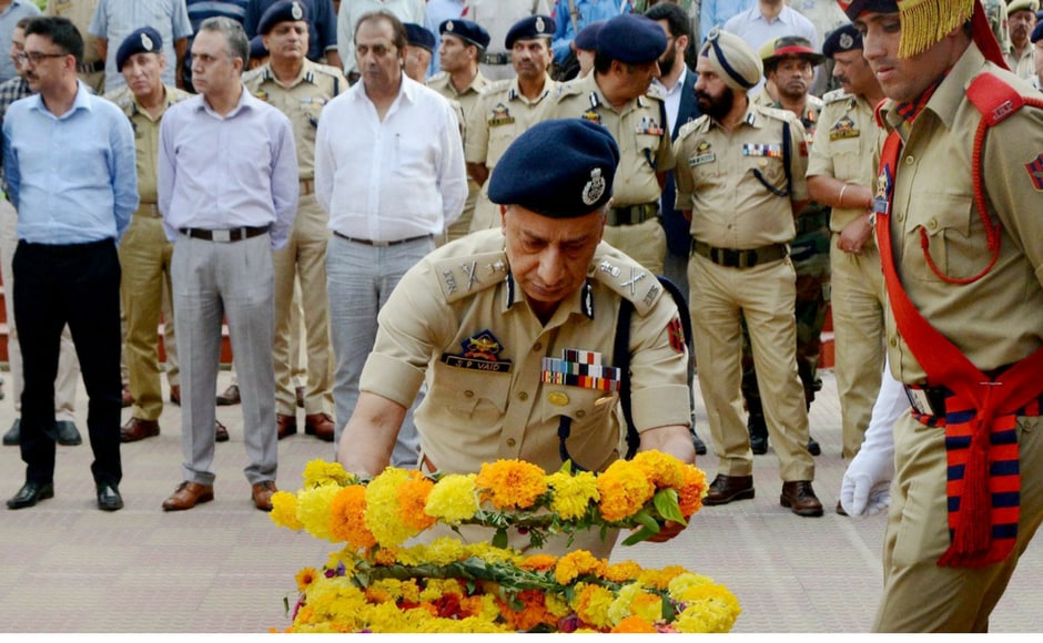 Director General of Jammu and Kashmir Police SP Vaid pays floral tribute to deceased officer ASI Abdul Rashid in Srinagar on Monday. PTI Director General of Jammu and Kashmir Police SP Vaid pays floral tribute to deceased officer ASI Abdul Rashid in Srinagar on Monday. PTI