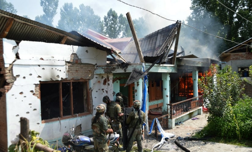 The house where militant commander Abu Dujana and his associate were holed up goes up in flames. Firstpost/Suhail Bhat