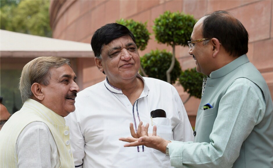 Samajwadi Party MP Naresh Agarwal (centre) chats with Congress leader Pramod Tiwari and UP health mMinister Siddharth Nath Singh at Parliament in New Delhi on Thursday. PTI Samajwadi Party MP Naresh Agarwal (centre) chats with Congress leader Pramod Tiwari and UP health mMinister Siddharth Nath Singh at Parliament in New Delhi on Thursday. PTI