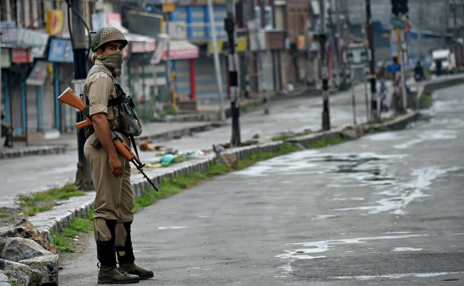 A security personnel stands guard during restrictions and strike in Downtown Srinagar on Wednesday. Authorities imposed restrictions as the separatists called for a fresh strike following the killings of two top Lashkar-e-Toiba militants and a civilian in Pulwama. PTI A security personnel stands guard during restrictions and strike in Downtown Srinagar on Wednesday. Authorities imposed restrictions as the separatists called for a fresh strike following the killings of two top Lashkar-e-Toiba militants and a civilian in Pulwama. PTI